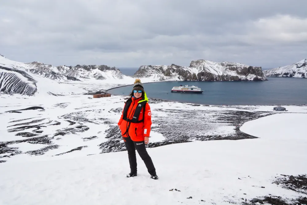 Woman Standing on Deception Island in Antarctica